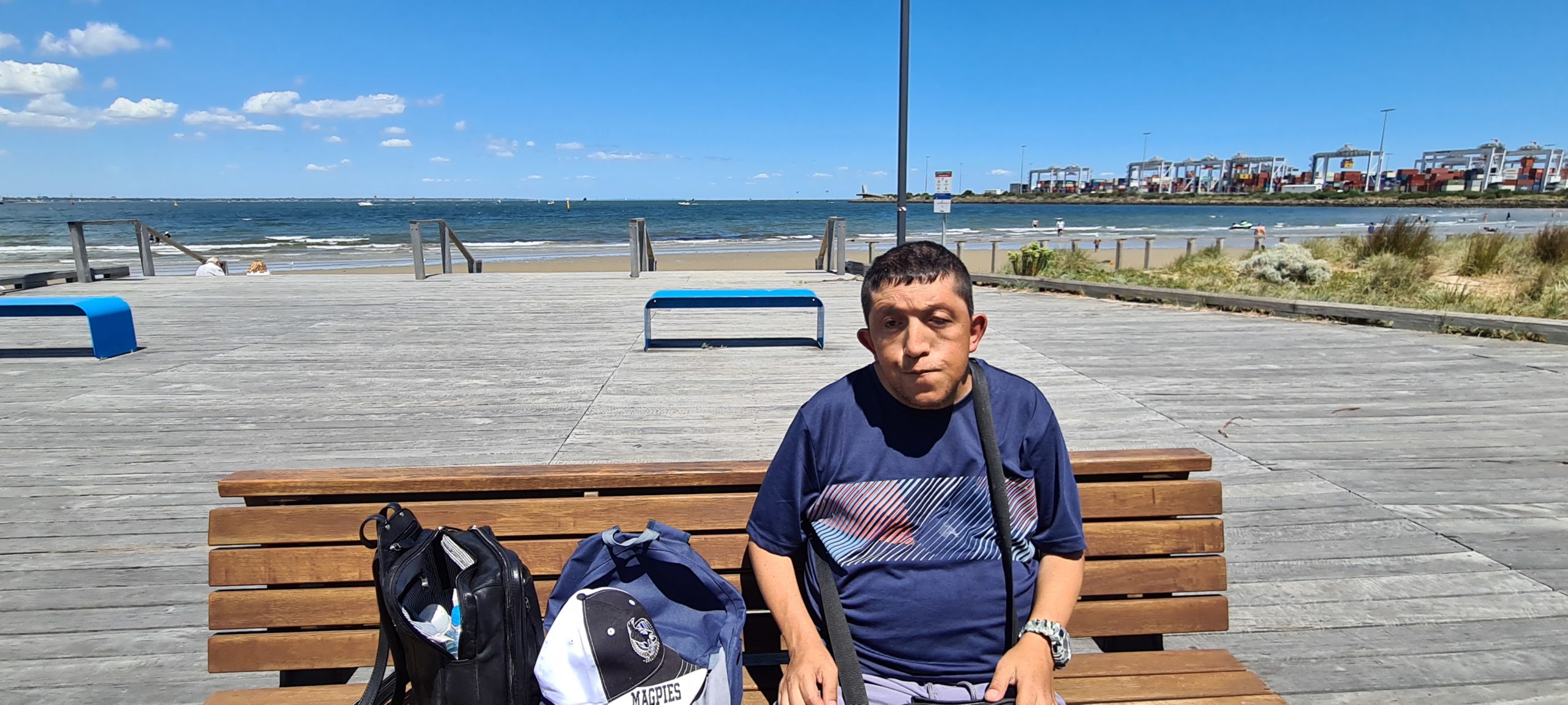 A person with disbility siiting near a beach at Grattan House in Victoria