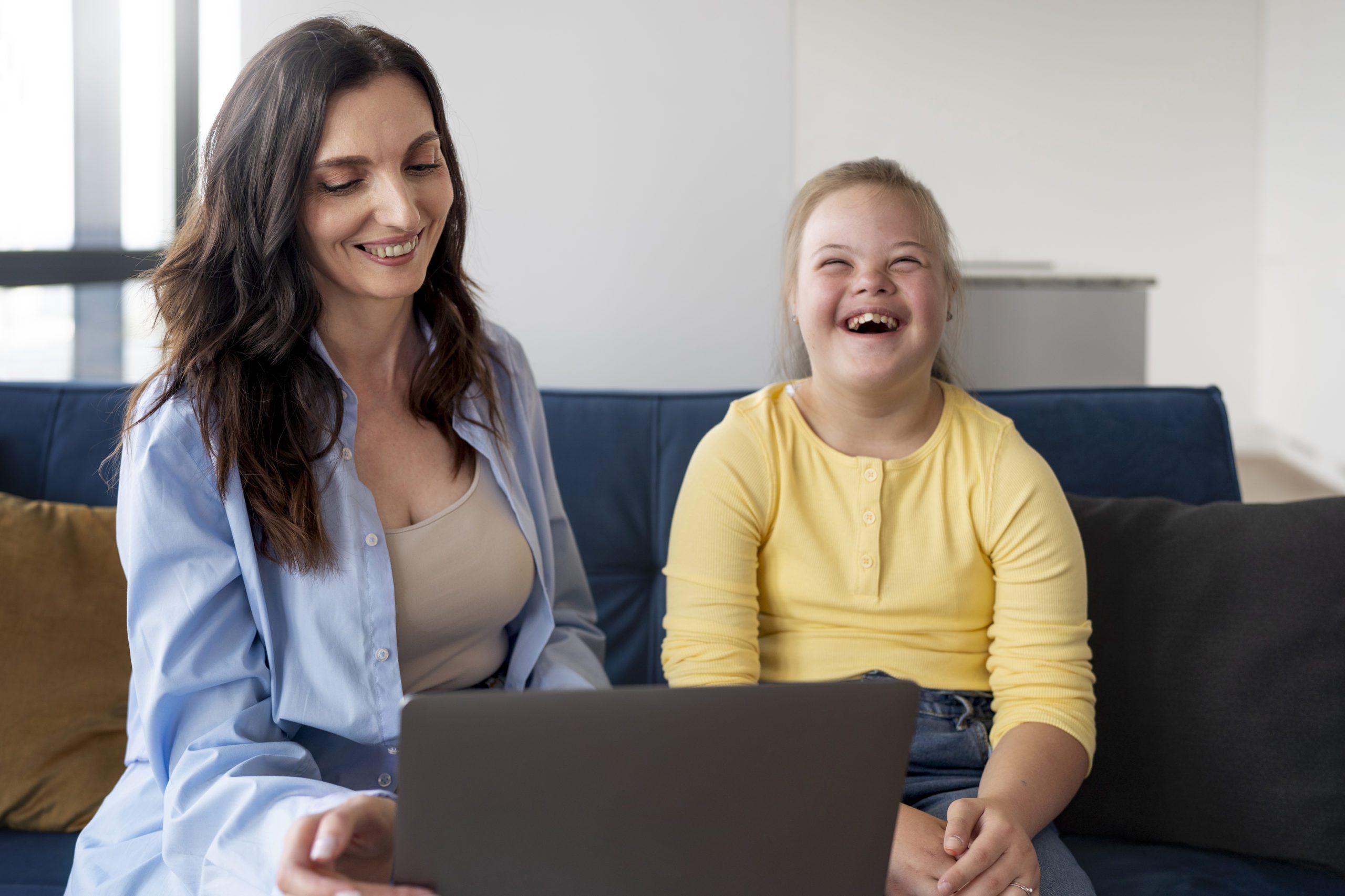 Smiling girl and woman indoors in VIC