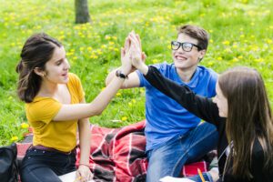 3 friends in the park in the disability community