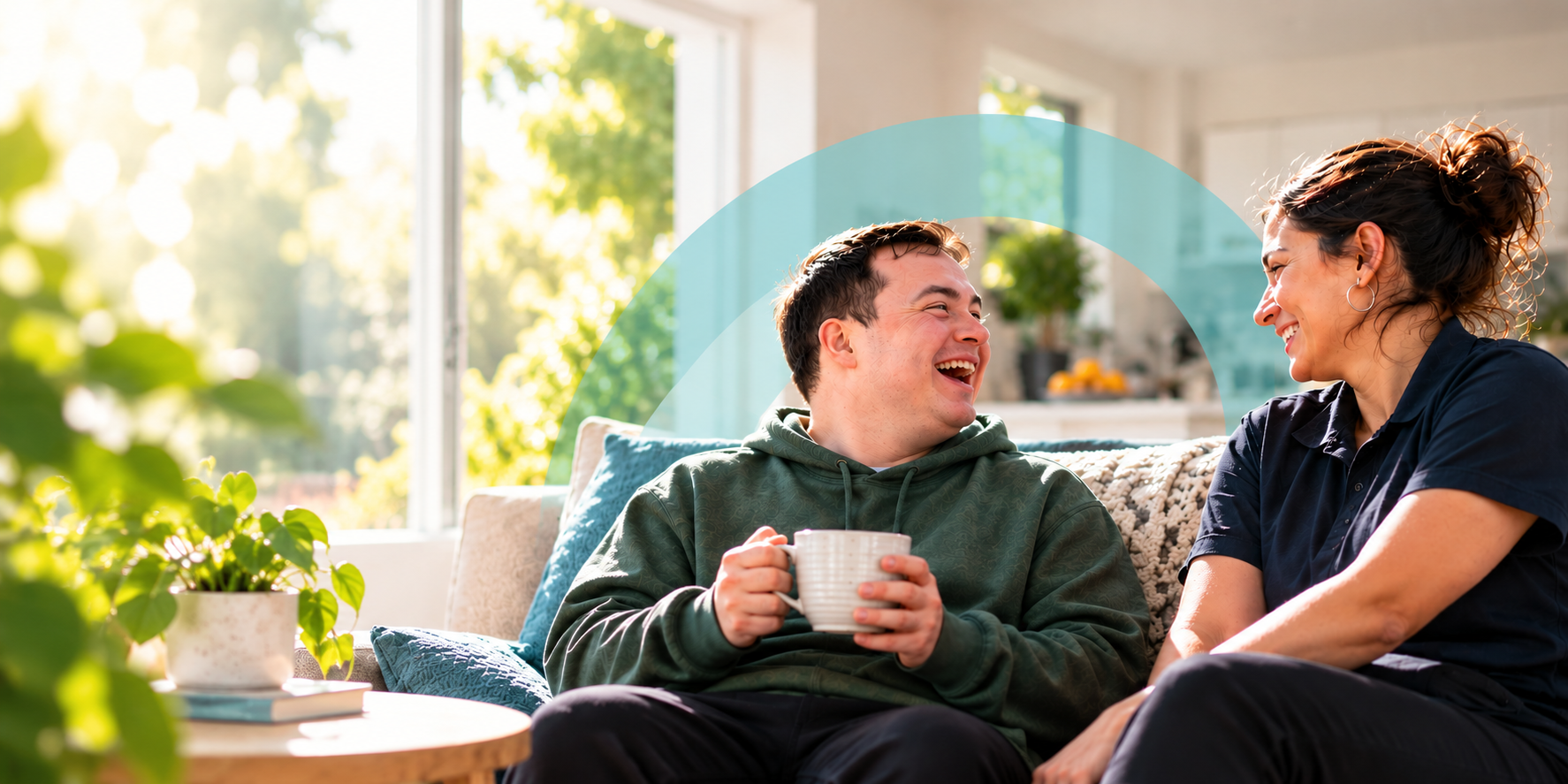 NDIS participant and support worker spending time together in a Supported Independent Living home